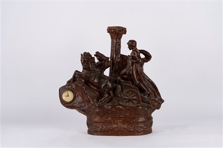 Scultura in terracotta smaltata a finto bronzo raffigurante auriga, con orologio