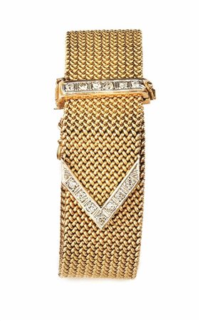 BRACCIALE IN ORO GIALLO, ORO BIANCO E DIAMANTIin oro giallo lavorato a nastro...