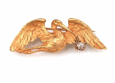 SPILLA IN ORO GIALLO E DIAMANTEmodellata come una cicogna che porta in dono...