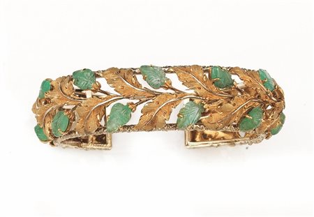 BRACCIALE, BUCCELLATI, IN ORO GIALLO, ORO BIANCO E SMERALDIa cerchio rigido...