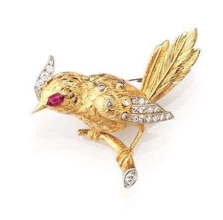SPILLA IN ORO GIALLO, ORO BIANCO, RUBINO E DIAMANTIdisegnata come un volatile...