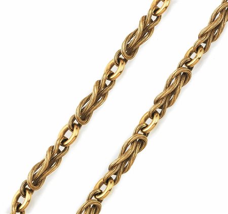 LUNGA CATENA IN ORO GIALLOrealizzata a maglie intrecciate satinate e anelli...