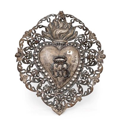  
Ex voto in lamina d'argento 
 cm 28x23,5 - gr. 60