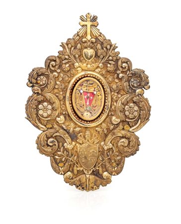  
Placca reliquiario in argento dorato, Roma, Stato Pontificio, prima metà del XIX secolo 
 cm 22,5x16 - peso complessivo gr. 290