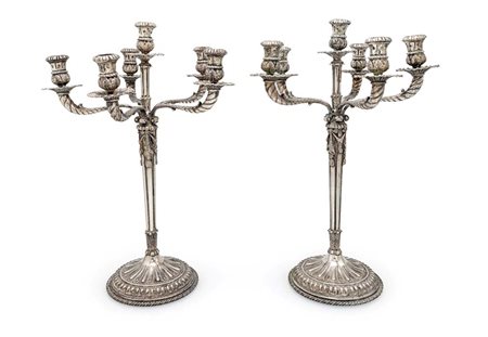  
Coppia di candelabri in argento 800/000 a sei luci 
 cm 42,5x30 - peso complessivo gr. 3630