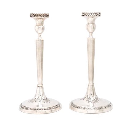  
Coppia di candelieri in argento 
 altezza cm 26,5 - gr. 466