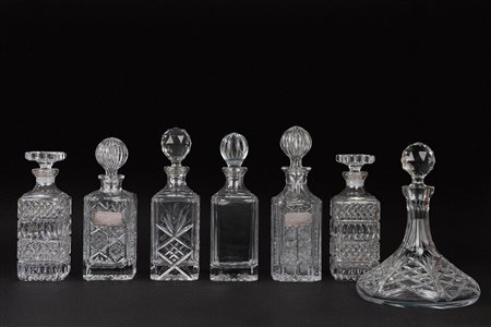 Sei bottiglie ed un decanter in cristallo di Boemia