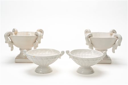 Due coppie di alzate biansate in ceramica smaltata bianca