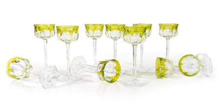 UNDICI CALICI IN CRISTALLO, BACCARAT, XX SECOLO, fusto trasparente e coppa in...