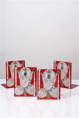 Piero Fornasetti (Milano 10/11/1913 - Milano 09/10/1988)  - Set di quattro fermalibri 'Strumenti musicali', 1960 circa