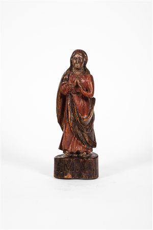 Madonna orante in legno intagliato e dipinto. Secolo XVIII.