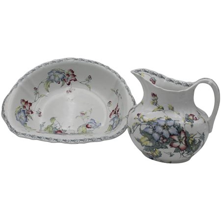 Brocca e bacile Ceramica decorata a motivi floreali e vegetali. Marcata...