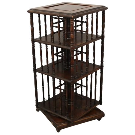 Libreria girevole Noce scolpito con colonne laterali. Fine secolo XIX. Cm...