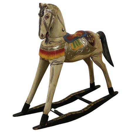Cavallo a dondolo Legno scolpito e dipinto. Sicilia. Secolo XX. Cm 100x28x95
