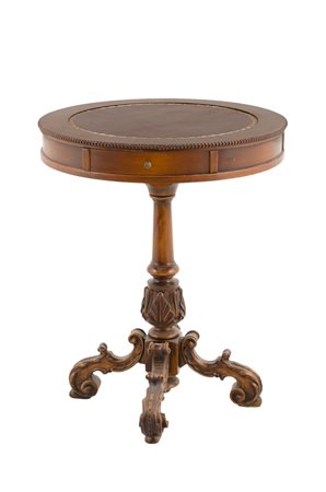 TAVOLINO circolare in noce con due cassettini, piano in ecopelle, fusto e...