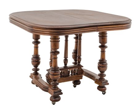 TAVOLO allungabile in noce con tre prolunghi. Francia XIX secolo Misure: cm...