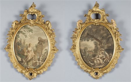 Coppia di cornici di forma ovale in stile barocco in legno finemente...