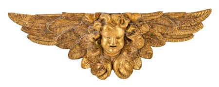 FREGIO in legno dorato raffigurante "testa di putto con ali". Sicilia XVIII...