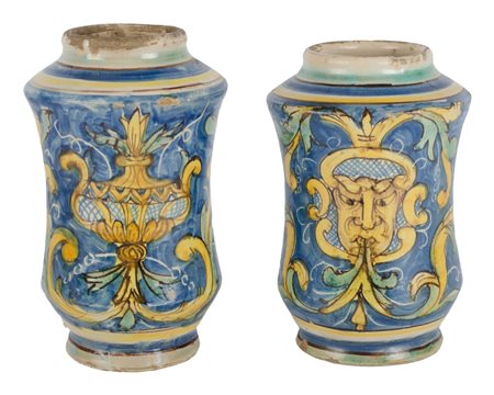 DUE ALBARELLI in ceramica smaltata e decorata a motivo floreale e fogliaceo...