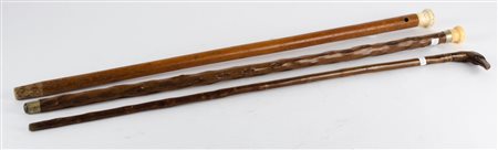LOTTO composto da due BASTONI in legno con manico in avorio e da BASTONE in...