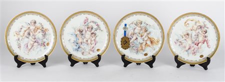 QUATTRO PIATTI in porcellana bianca Limoges decorata raffigurante "putti" con...