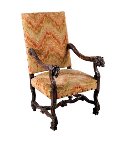 Una poltrona in noce ad “osso di montone” Schienale e seduta imbottiti,...