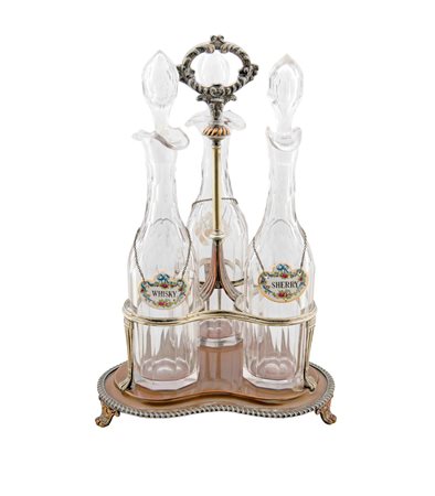 Portaliquori in metallo argentato e tre bottiglie in cristallo Misure cm 40 x 26