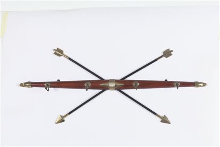 UN APPENDIABITI DA PARETE, anni '30. Legno di palissandro, tubo di ferro...