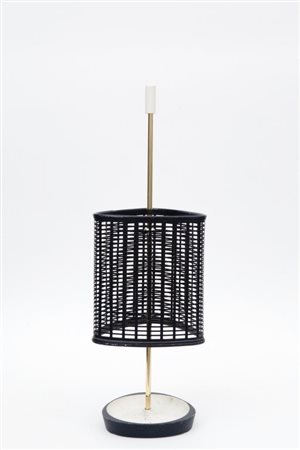 UN PORTAOMBRELLI, anni '50. Ghisa verniciata, ottone, rete di ferro...