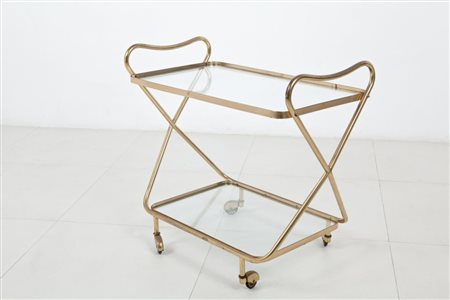UN CARRELLO, anni '50. Ottone, cristallo. Cm 67 (h) x 72 x 40.