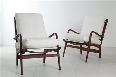 CERUTTI (Editore)Due poltrone, anni '60. Legno di faggio tinto all'anilina,...