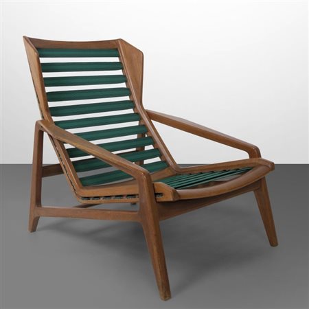 GIO PONTI Una poltrona "811" per CASSINA, 1957. Legno di noce, materassino...