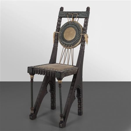 CARLO BUGATTI Una sedia, inizi '900. Legno intagliato tinto all'anilina con...