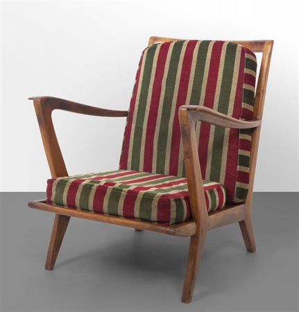 GIO PONTI Una poltrona "516" per CASSINA, anni'50. Legno di noce, cuscini...