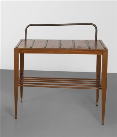 GIO PONTI Un supporto per valigie, 1953. Legno di mogano, ottone. Cm 65 (h) x...
