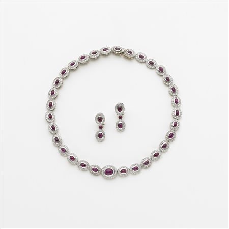 Demi-parure composta da collier ed orecchini a moduli ovali in oro bianco con...