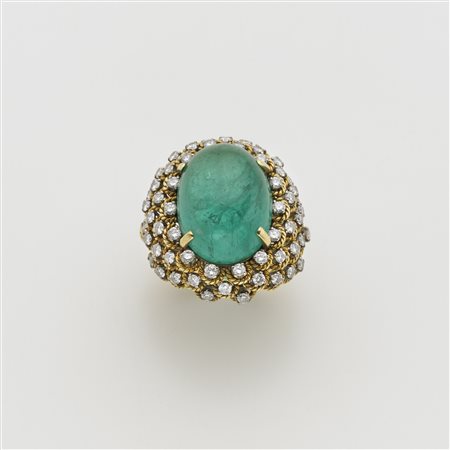 Anello in oro giallo e bianco con diamanti rotondi montati come ad occhi di...