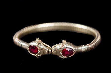 BRACCIALE semirigido a guisa di serpenti in oro giallo basso titolo con...