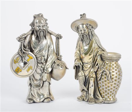 COPPIA SCULTURE in lamina d'argento raffiguranti "figure orientali". XX...