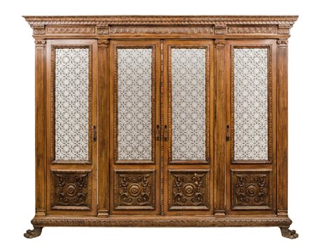 LIBRERIA stile rinascimentale a quattro ante in noce. Sicilia meta' '900...