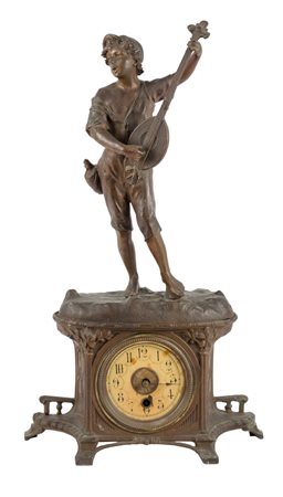 OROLOGIO in metallo raffigurante "suonatore di mandola". Periodo Liberty...