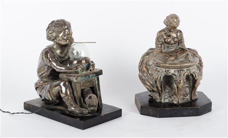 DUE SCULTURE in terracotta rivestite in metallo argentato raffiguranti "donna...