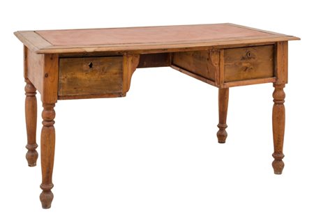 SCRITTOIO in noce con due cassetti, piano in pelle (usure). Italia XIX secolo...