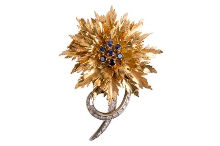 Spilla fiore con zaffiri e brillanti. Oro 18 Kti. Zaffiri cti 0,70 c.ca...