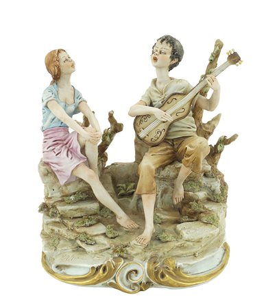 Gruppo in porcellana policroma Capodimonte, XX Sec. 20x18x18 cm. raffigurante...