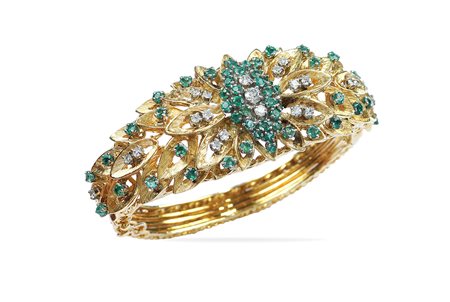 Bracciale a manetta in oro giallo 18kt anni 50/60 peso 58,3 gr. a motivo...