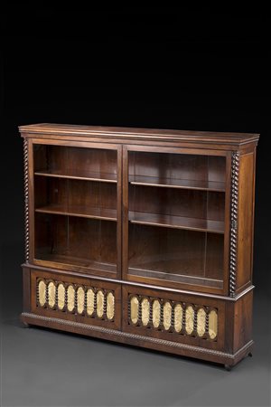 Piccola libreria a due ante a vetri e due sportelli nella base a listelli...