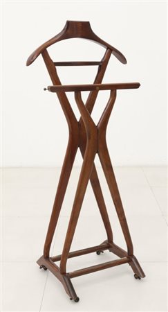 FRATELLI REGUITTI Un indossatore, anni "60. Legno di faggio tinto...