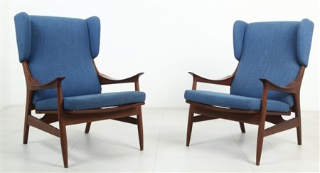 DUE POLTRONE, anni '60. Legno di teak, imbottiture originali rivestite in...