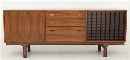 UNA CREDENZA, anni "60 Legno di palissandro, legno impiallacciato in...